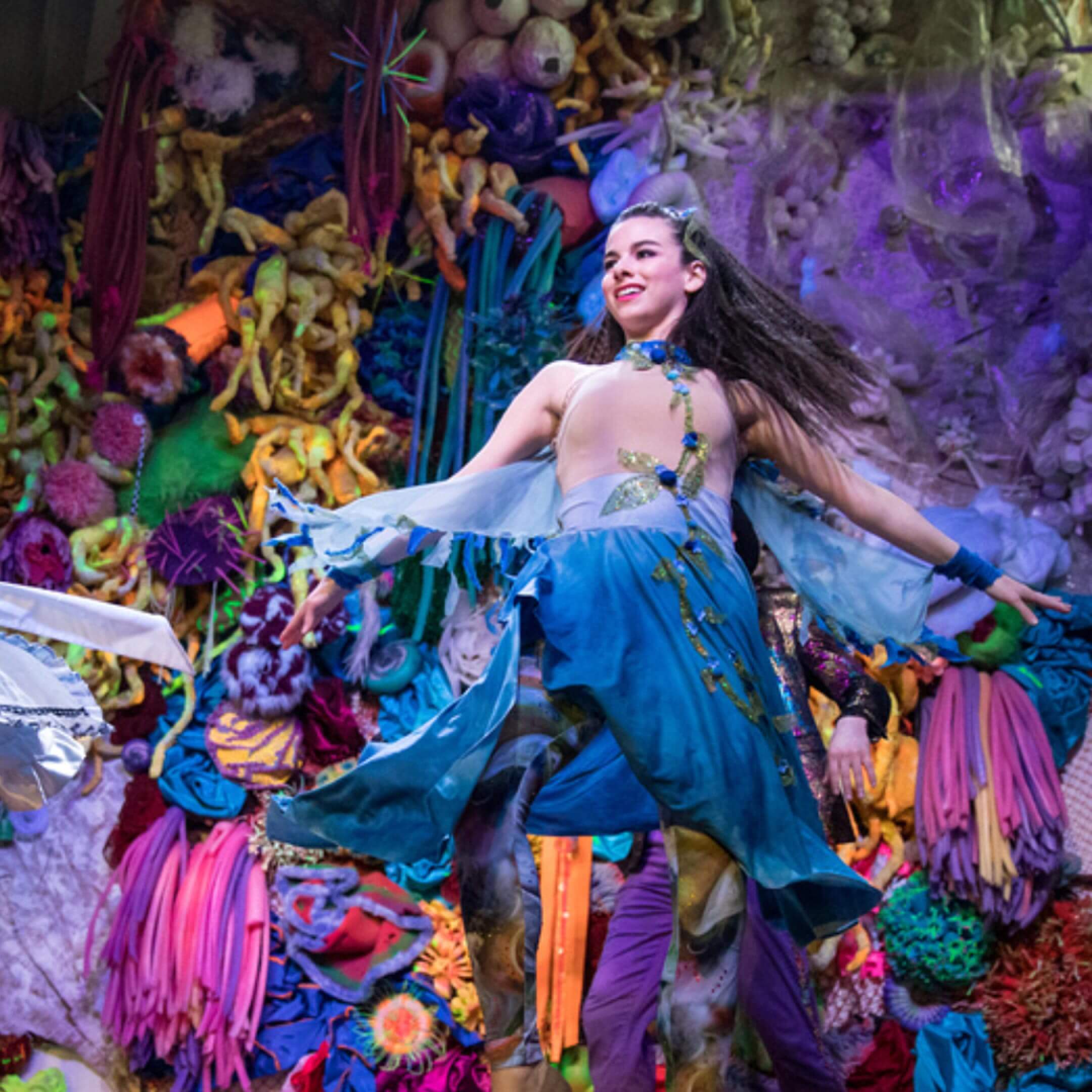 person dancing on decorated stage in costume
